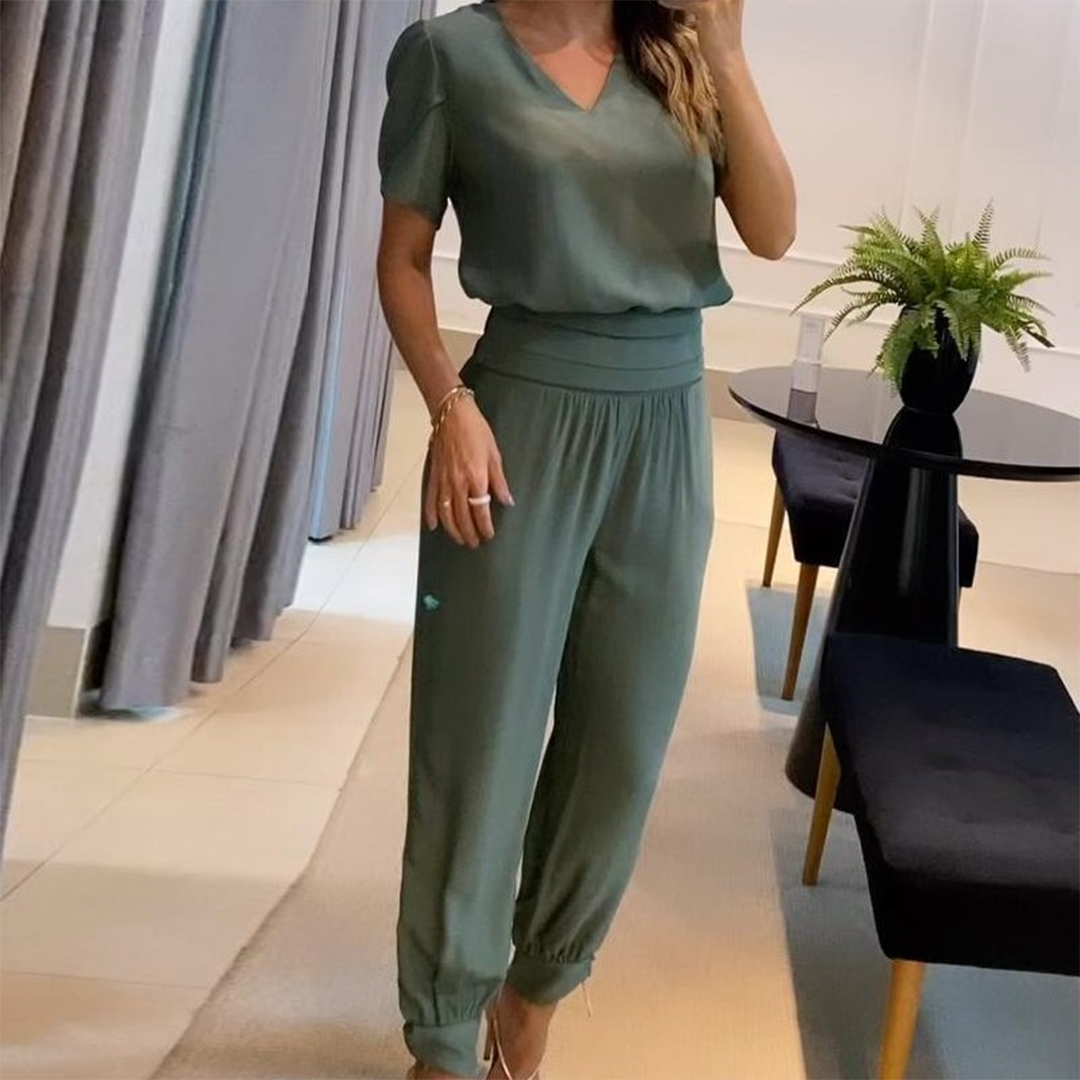 Stylish women's printed V-neck jumpsuit featuring a flowing wide-leg & comfortable relaxed fit.