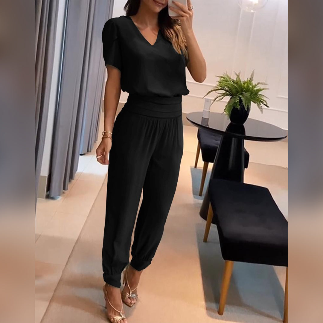 Women's printed V-neck wide-leg jumpsuit with tie waist, perfect for stylish everyday wear & summer fashion.