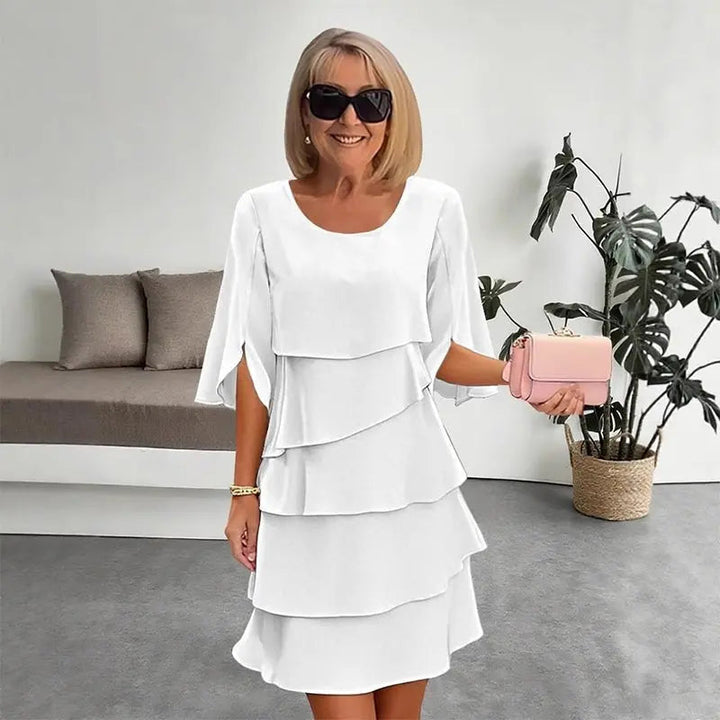 Chic women's layered ruffle dress with three-quarter sleeves. Elegant yet casual, perfect for versatile day-to-night wear.
