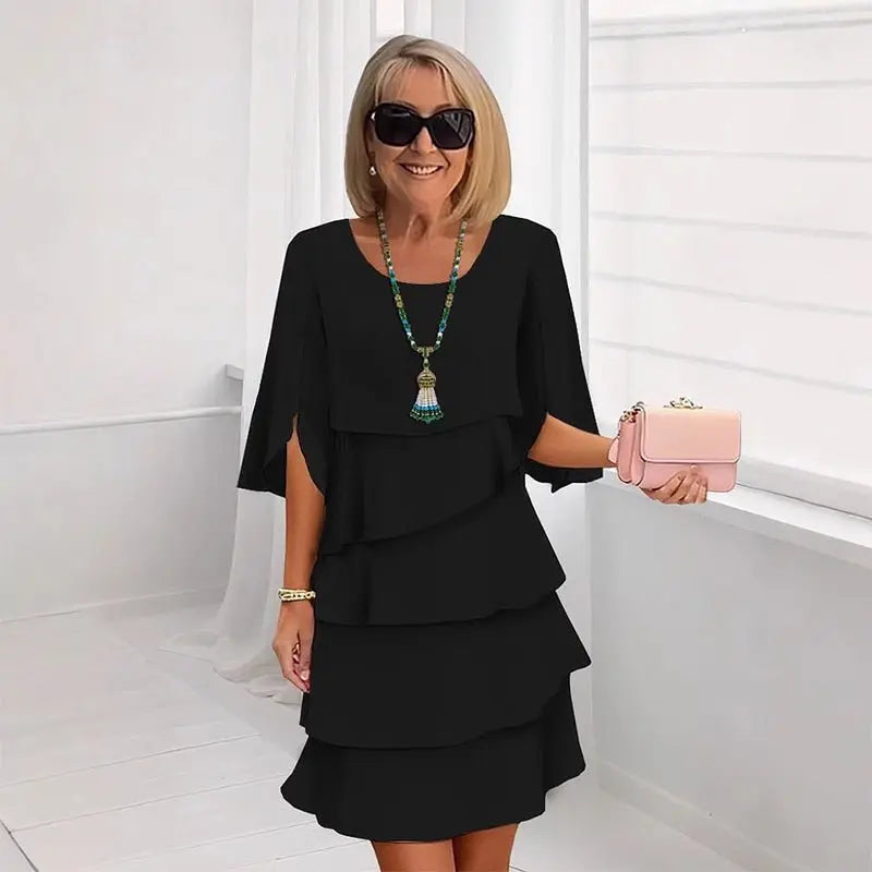 Stylish women's three-quarter sleeve layered ruffle dress. Versatile for casual outings or formal elegant events in spring.