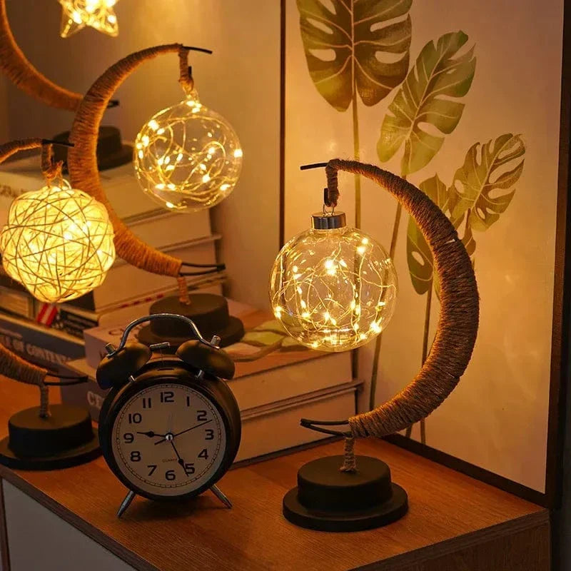 "LED Moon Star Night Light with hemp rope, moon-shaped, emits warm glow, ideal decor for cozy rooms, rustic charm."