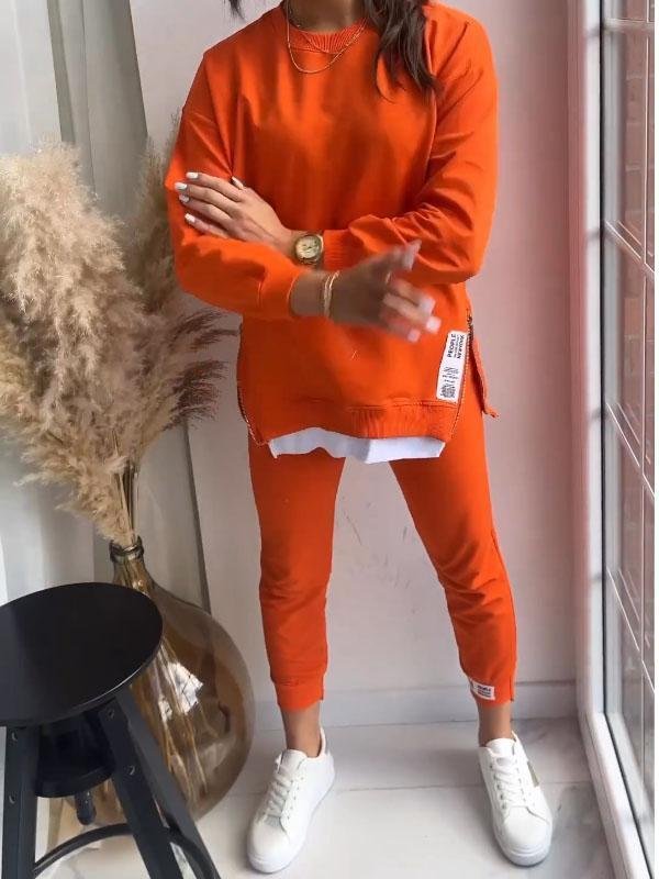 Women's cozy loungewear set with soft sweatshirt and comfortable pants for relaxation.