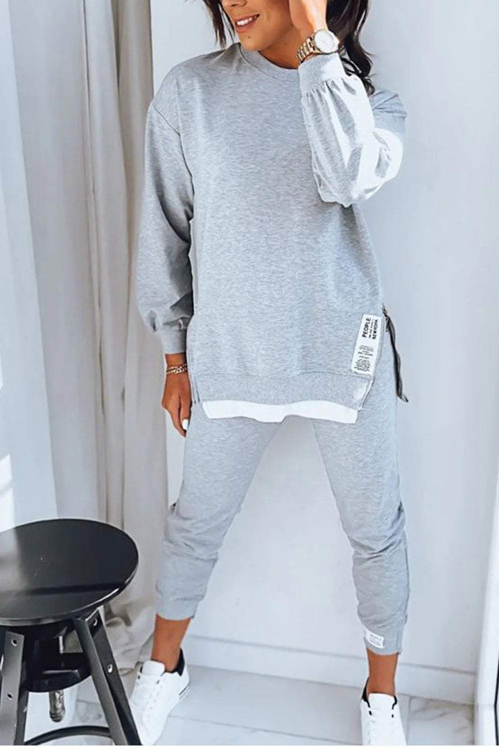 Stylish women's cozy sweatshirt and pants set, perfect for home relaxation or casual fashion.