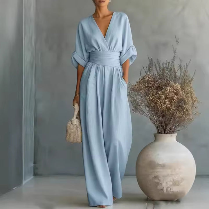 Versatile women's wide-leg jumpsuit with deep V-neck, suitable for casual chic or evening events.