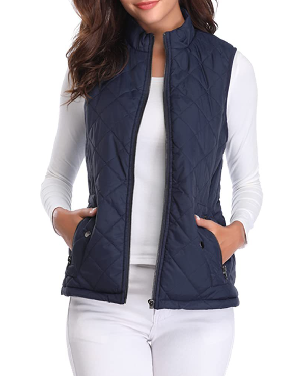 Women's padded vest styled casually, perfect lightweight layer for transitional weather. Fashionable.