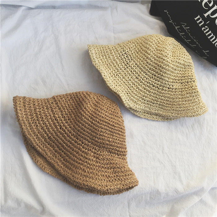 Crochet straw bucket hat for women, featuring a wide brim for maximum sun protection. A summer essential.