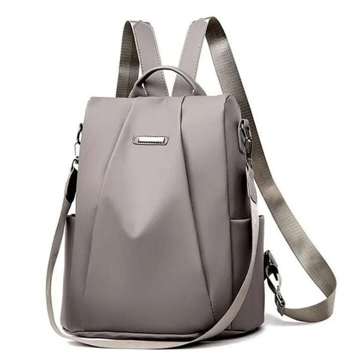 Versatile women's multi-way nylon backpack converts to a crossbody bag. Water-resistant & travel-friendly.