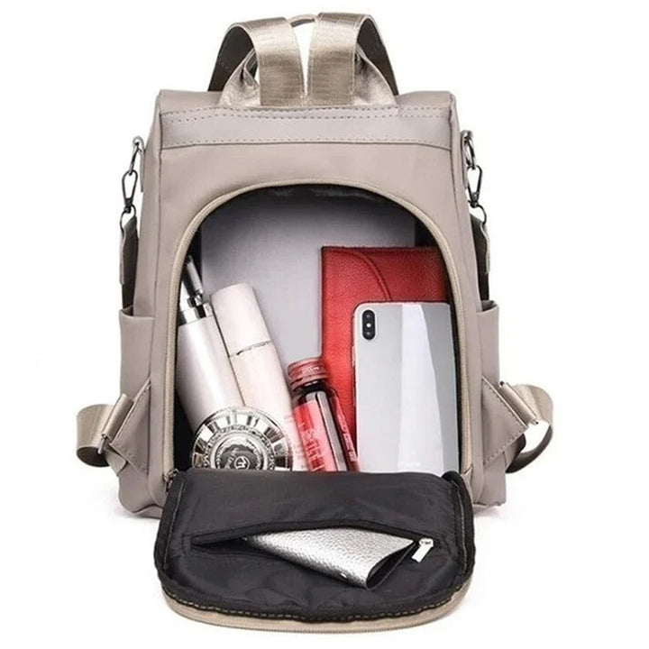Stylish water-resistant nylon shoulder bag for women. This lightweight multi-way backpack is perfect for daily use.