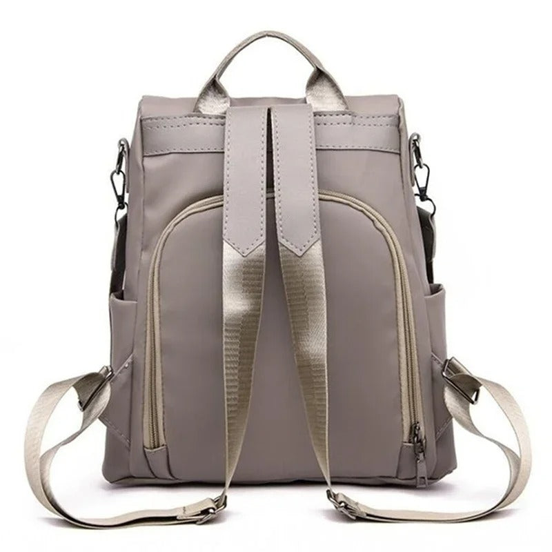 Durable water-resistant nylon women's backpack, lightweight and minimalist for travel or daily commutes.