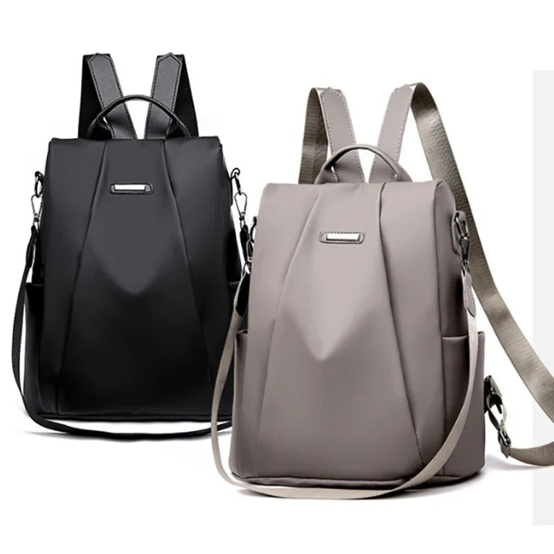 Sleek women's water-resistant nylon backpack. Lightweight, minimalist design with multi-way carry for modern life.