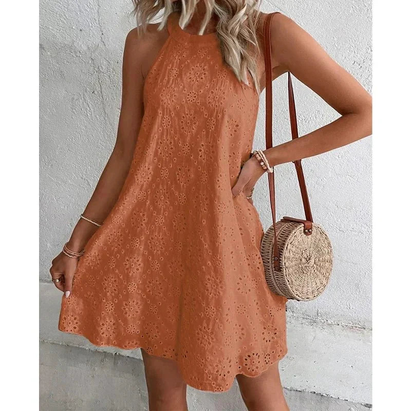 Trendy women's effortless sleeveless mini dress, perfect for a chic and comfortable summer look.