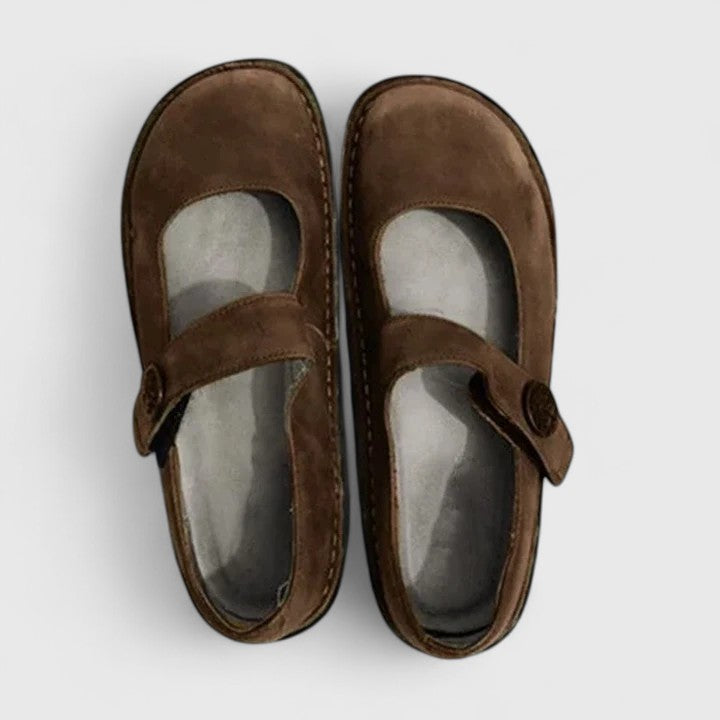 Classic women's flat Mary Jane shoes, comfortable & stylish with a rounded toe, single strap, and stitch-defined sole.