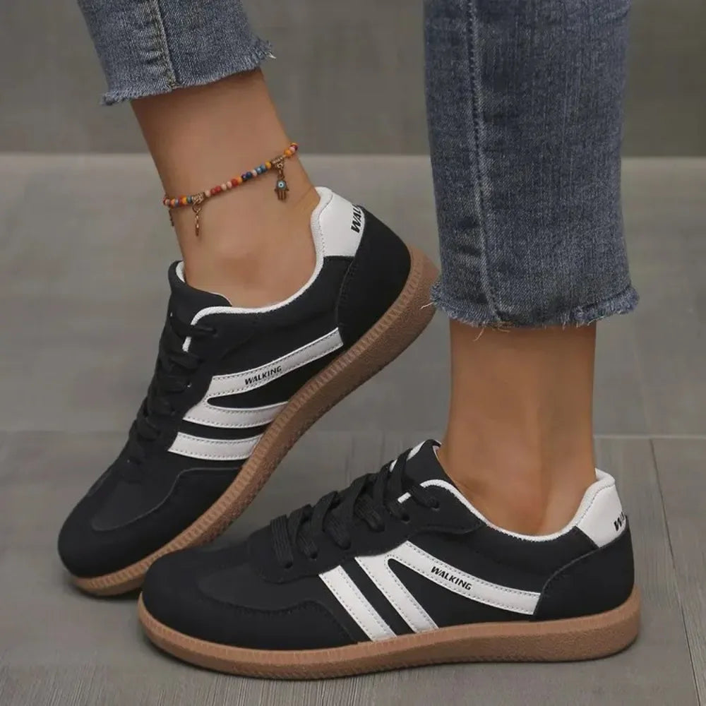 Women's classic low-top casual sneakers; comfortable, versatile everyday footwear for iconic style.