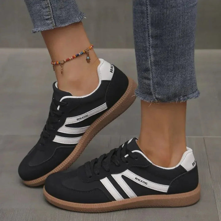 Women's classic low-top casual sneakers; comfortable, versatile everyday footwear for iconic style.