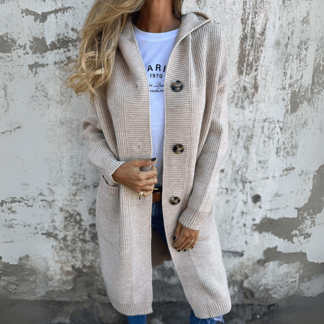 Close-up of a women's long chic cardigan, showcasing soft knit texture and elegant drape for versatile fashion.