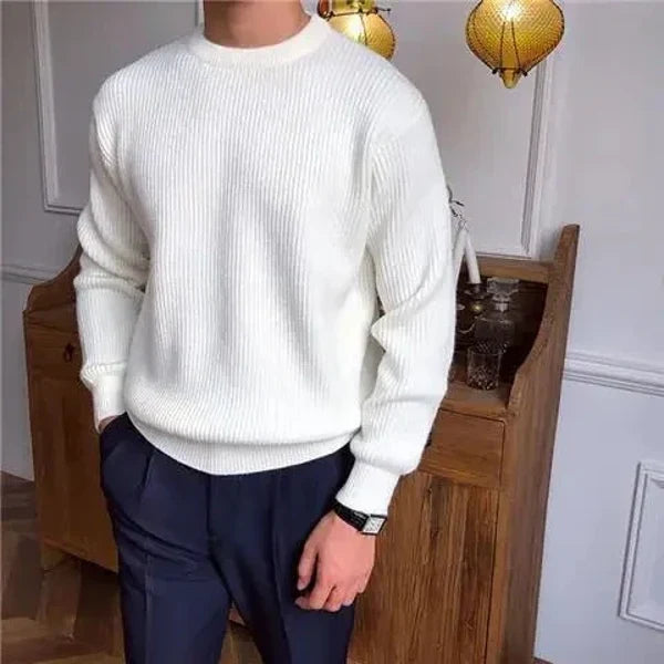 Man modeling a comfortable grey pullover sweater, showcasing its casual everyday appeal.
