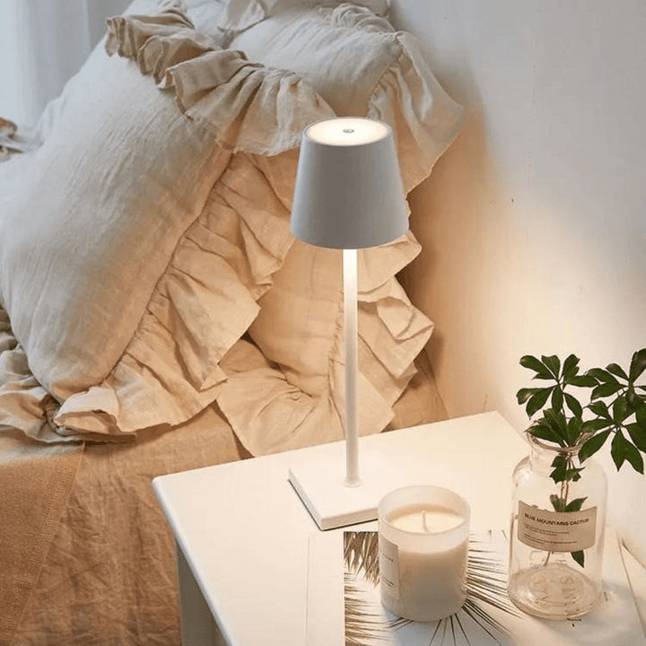 Portable LumoGlow LED table lamp for indoor & outdoor ambiance, USB rechargeable.