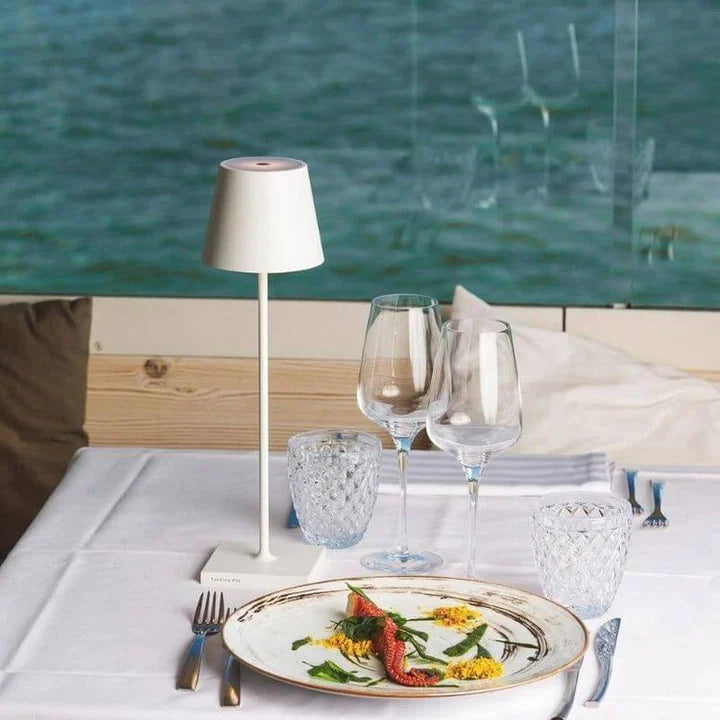 Versatile LumoGlow LED table lamp, wireless, rechargeable, for indoor/outdoor settings.