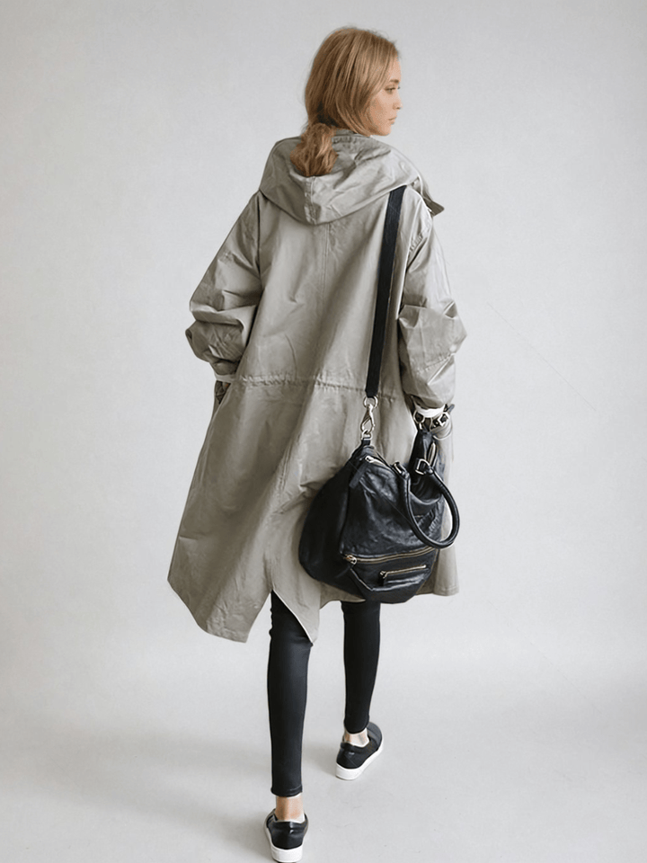 Elegant women's water-repellent trench coat. Stylish outerwear, perfect for all seasons & rain protection.