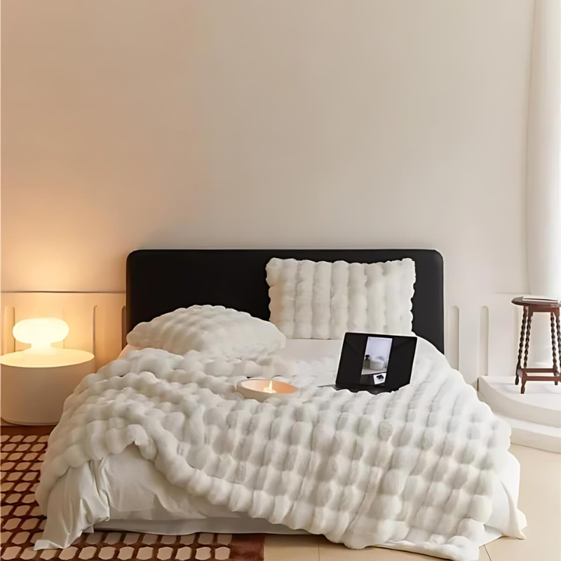 "Luxurious double-sided fleece and faux fur blanket for ultimate warmth, soft texture; ideal bedding or decorative throw."
