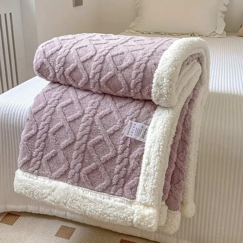 Luxurious sherpa blanket with plush, soft texture, reversible design; perfect for cozy all-season comfort and decoration.