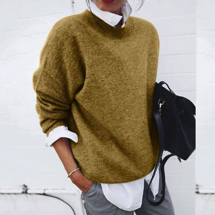 Luxurious women's knit sweater, modern timeless style for fall/winter, cozy pullover chic.