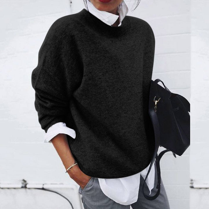 Elegant women's knit sweater, timeless modern pullover style for versatile fall/winter fashion.