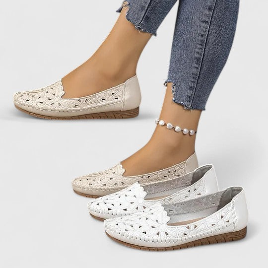 Stylish women's beige perforated slip-on flats, breathable for spring/summer comfort.