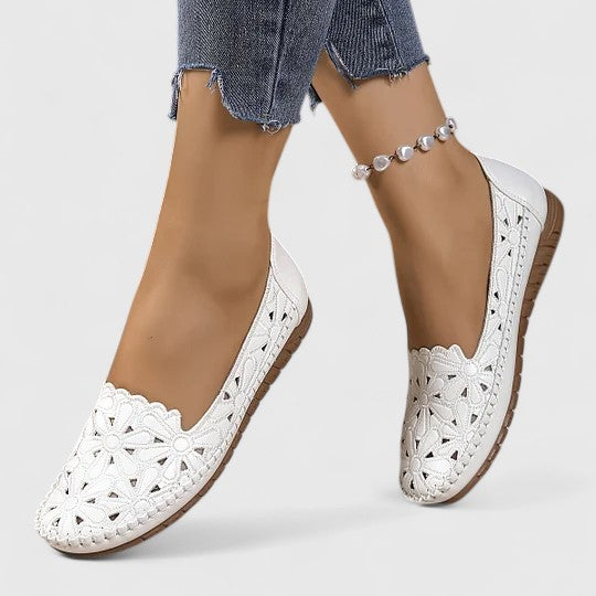 Women's all-day comfort perforated slip-on flats, ideal for breathable casual style.