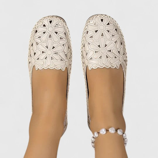 Spring/summer women's perforated slip-on flats, providing stylish breathable comfort.