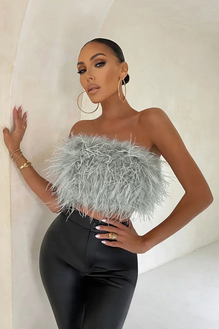 Fashionable feather tube top, an elegant sleeveless top for women's special occasions.