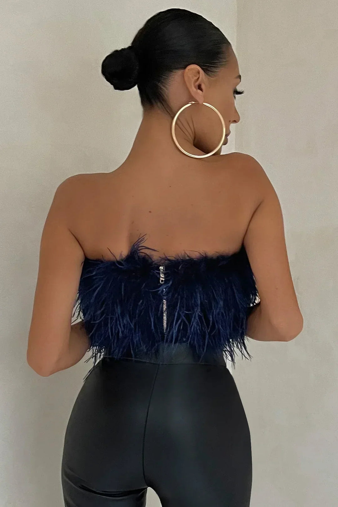 Women's trendy feather crop top, perfect for parties & sophisticated summer looks.