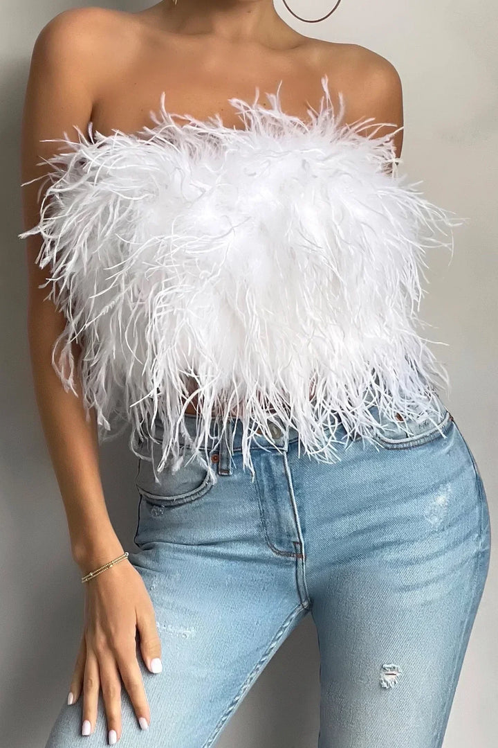 Stylish women's crop top with feather trim, a trendy sleeveless party top.