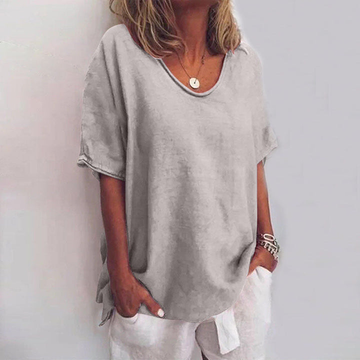 Comfortable women's fashion top, versatile for work or everyday, offering a flattering loose fit.