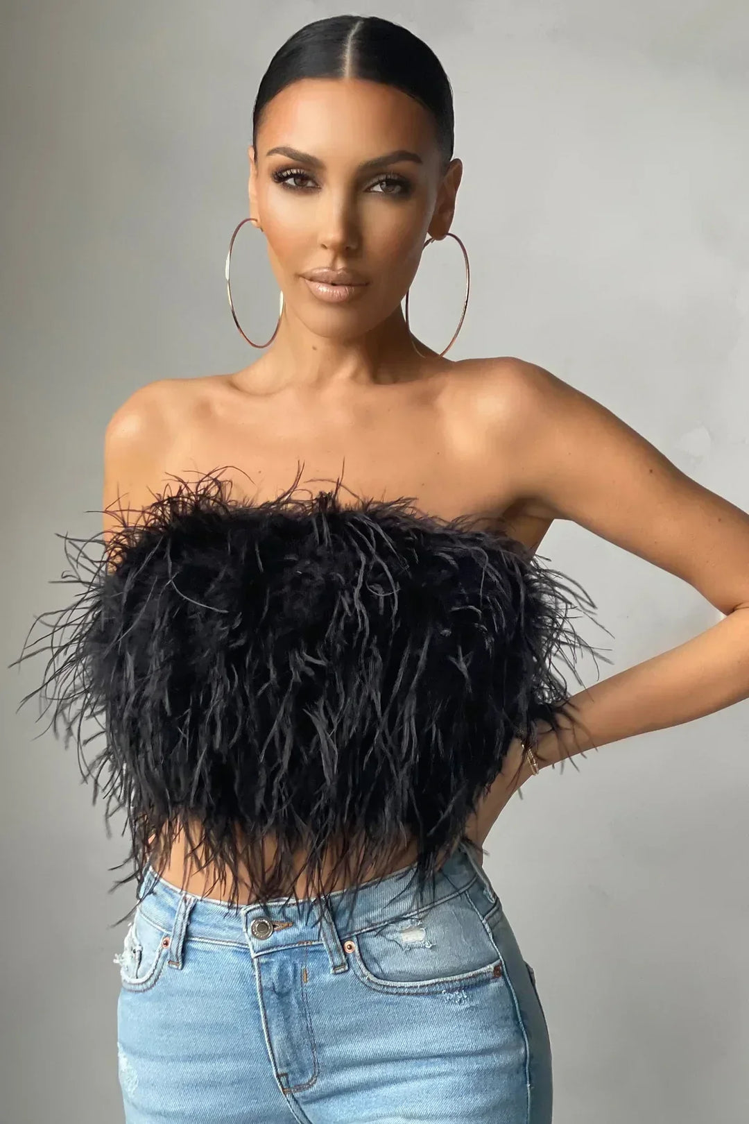 Sleeveless feather tube top, an elegant & trendy piece for women's summer fashion.