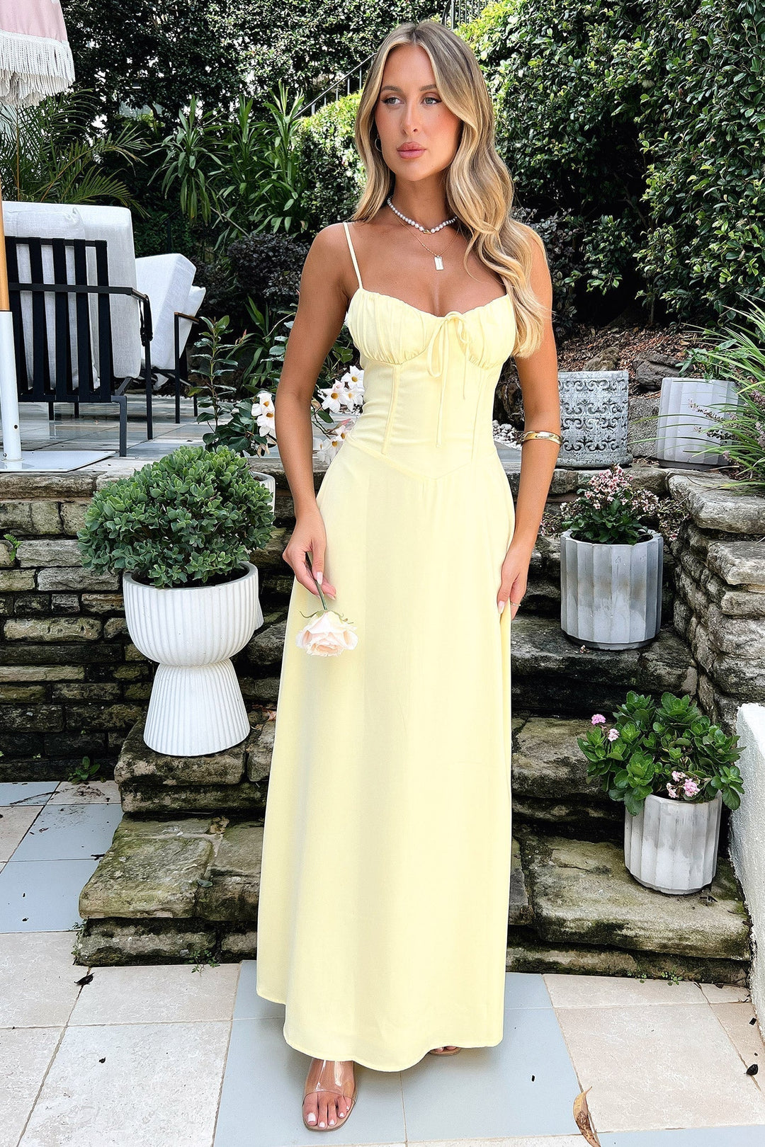 Elegant sleeveless maxi dress for women, perfect as a wedding guest outfit or stylish summer evening wear.