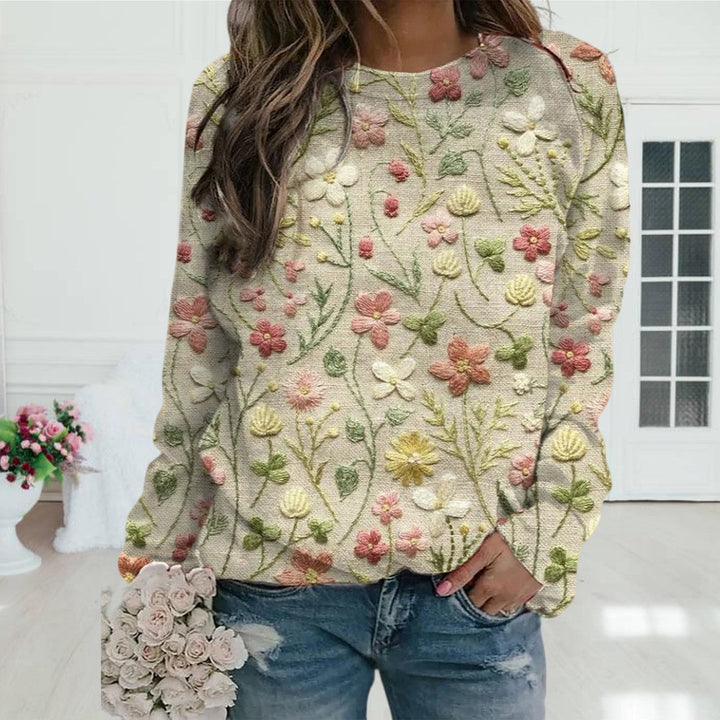 Women's lightweight floral embroidered spring sweater. Chic crewneck knitwear perfect for casual everyday wear.