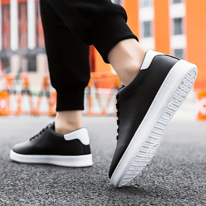 Everyday men's black low-top trainers, a comfortable and stylish classic for modern casual wear.