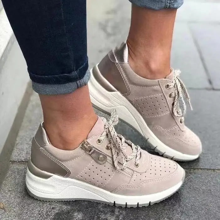 Modern women's platform wedge lace-up sneakers with side zip, ideal for casual wear.