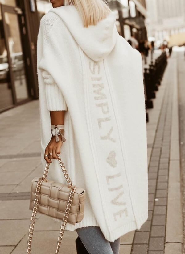 Stylish women's long cardigan for easy layering. Comfortable, relaxed fit, perfect for versatile everyday looks.