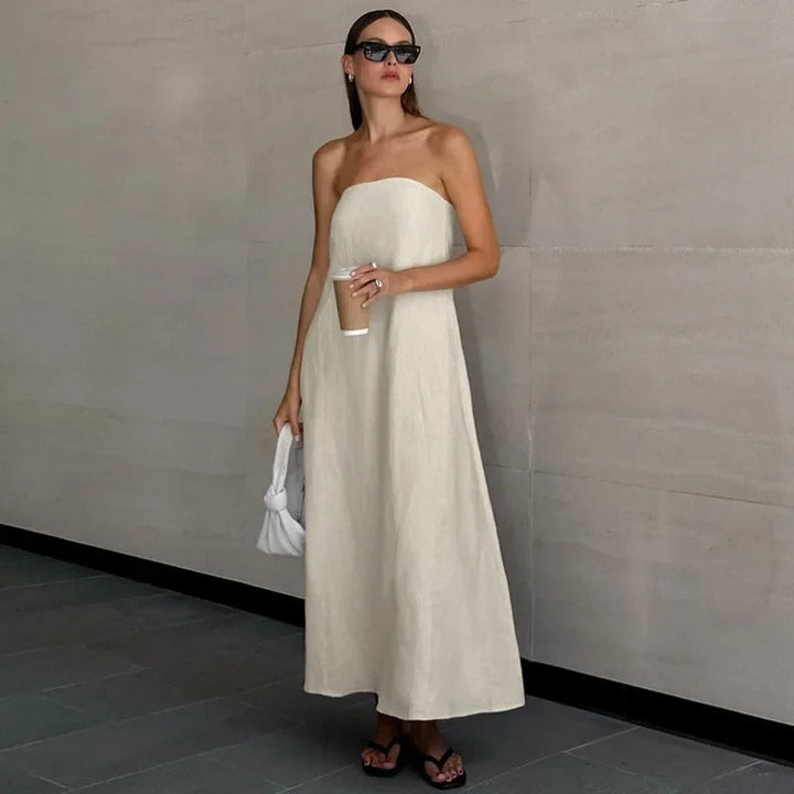 Flowing women's elegant strapless maxi dress for summer. Relaxed fit, minimalist chic, perfect for holiday wear.