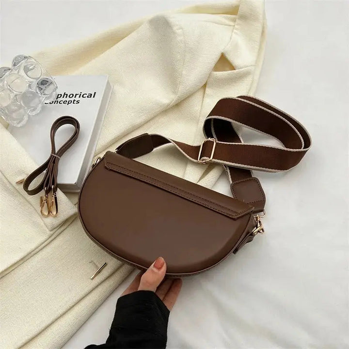 Compact women's luxurious everyday shoulder bag, versatile & chic, featuring an adjustable strap.