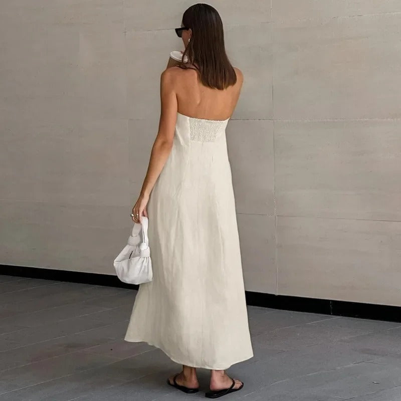 Chic women's strapless maxi dress, ideal for summer events. Elegant, flowing, and minimalist for any occasion.
