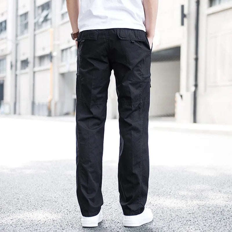 Black stretch cargo pants for men, stylish utility design with relaxed fit and multi-pockets.