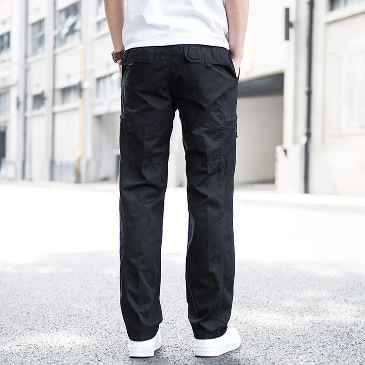 Black stretch cargo pants for men, stylish utility design with relaxed fit and multi-pockets.