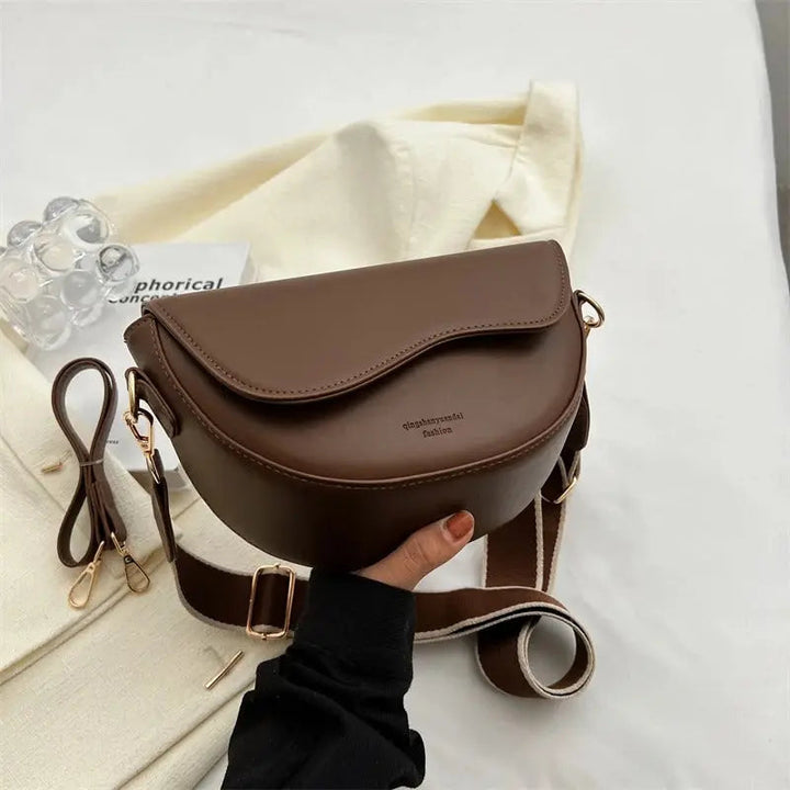 Versatile women's shoulder bag with adjustable strap, ideal for daily essentials & stylish looks.