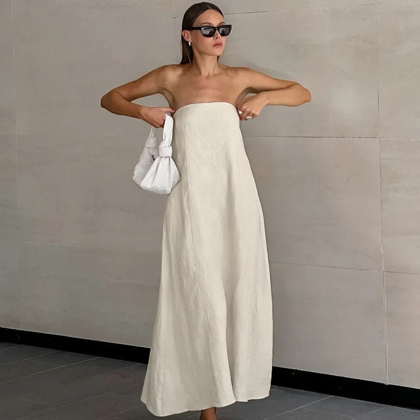 Elegant women's maxi strapless dress for summer holidays, featuring a flowing silhouette and minimalist style.