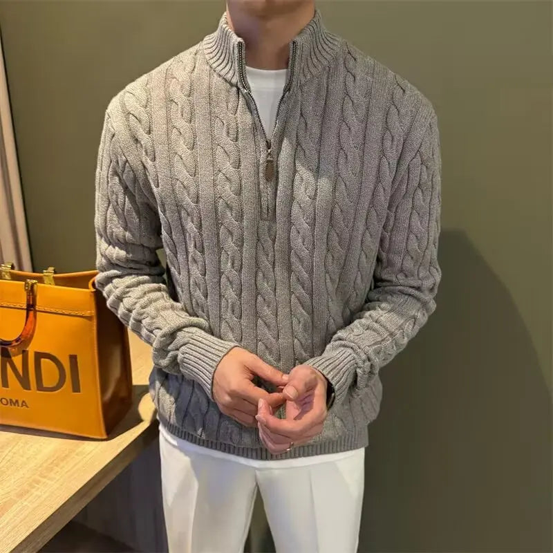 Warm men's zip-up cable knit sweater, a stylish and comfortable choice for cold weather.