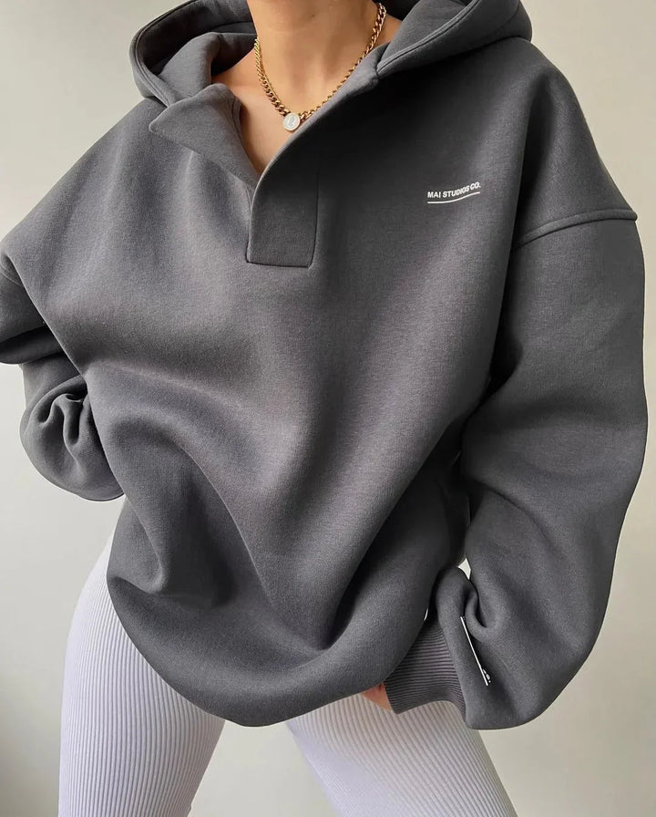 Stylish women's oversized pullover hoodie. Perfect layering top with a trendy notch neck.