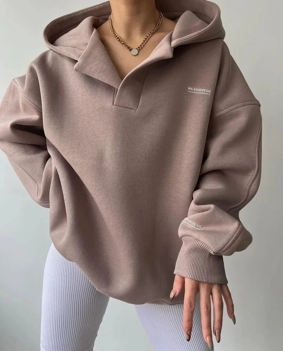 Versatile women's oversized hoodie. Pullover style with notch neck, ideal for casual layering.